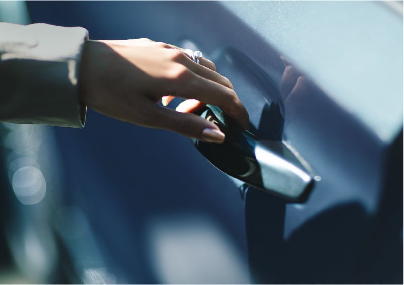 A hand gracefully grips the Light Touch Handle of a 2023 Lincoln Aviator® SUV to demonstrate its ease of use | Mark McLarty Lincoln in North Little Rock AR