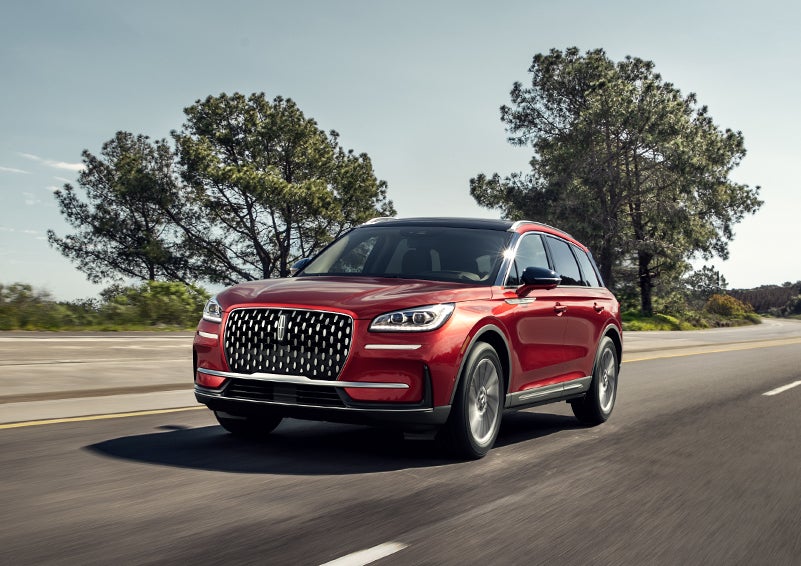 A 2024 Lincoln Corsair® SUV is shown being driven on a country road. | Mark McLarty Lincoln in North Little Rock AR