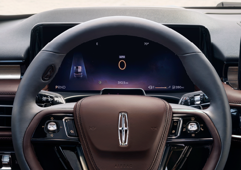 The steering wheel of 2025 Lincoln Aviator® SUV is shown with black and brown accents. | Mark McLarty Lincoln in North Little Rock AR