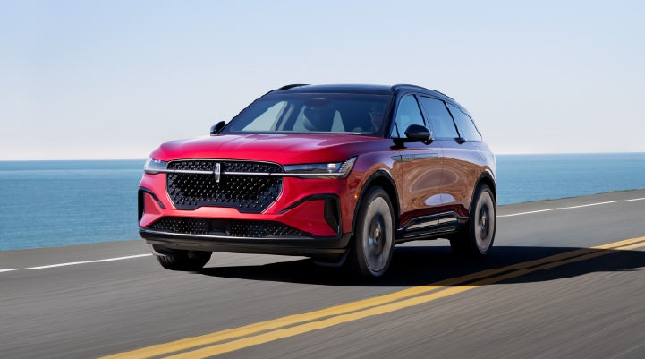 A 2025 Lincoln Nautilus® SUV is being driven on a seaside roadway. | Mark McLarty Lincoln in North Little Rock AR