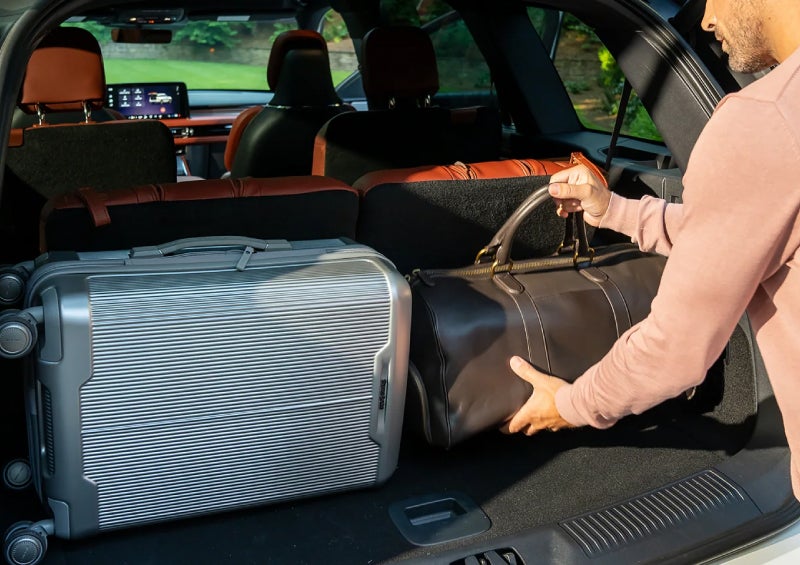 A man loads luggage into the rear of a 2026 Lincoln Aviator® SUV through the opened rear liftgate. | Mark McLarty Lincoln in North Little Rock AR
