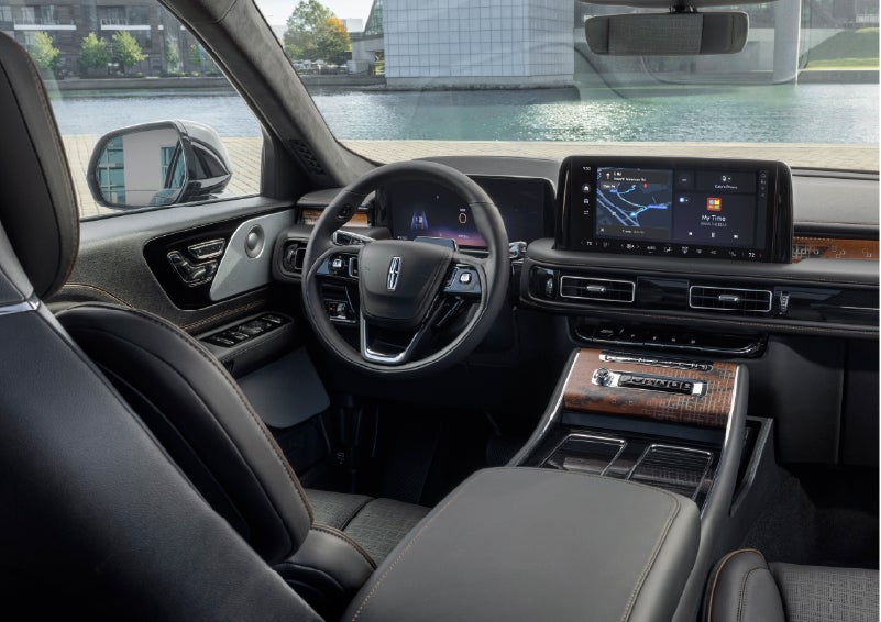The interior of the 2026 Lincoln Aviator® SUV is shown parked with a view of a harbor through the windshield. | Mark McLarty Lincoln in North Little Rock AR