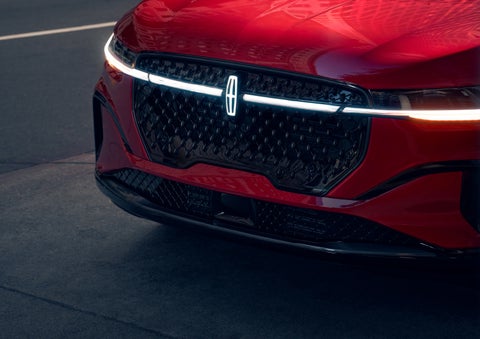 The available front LED light bar and center Lincoln Star logo glow at dusk. | Mark McLarty Lincoln in North Little Rock AR