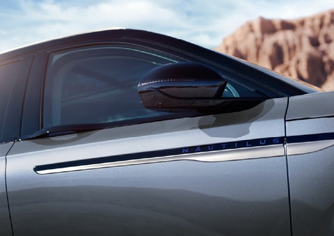 Blue lettering on the side of the vehicle that reads Nautilus indicates the available Hybrid Powertrain. | Mark McLarty Lincoln in North Little Rock AR