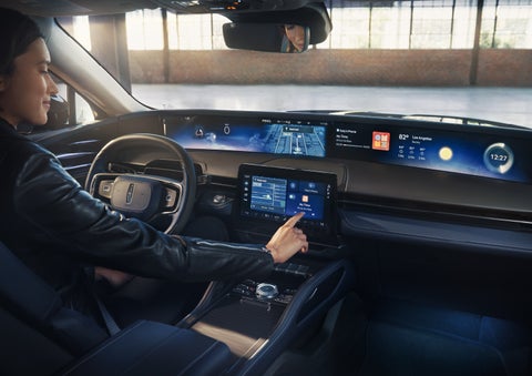 The driver of a 2026 Lincoln Nautilus® SUV interacts with the center touchscreen. | Mark McLarty Lincoln in North Little Rock AR