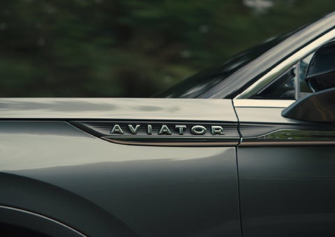 The driver’s side door and fender badging of a gray 2027 Lincoln Aviator® SUV are showcased. | McLarty Lincoln in North Little Rock AR