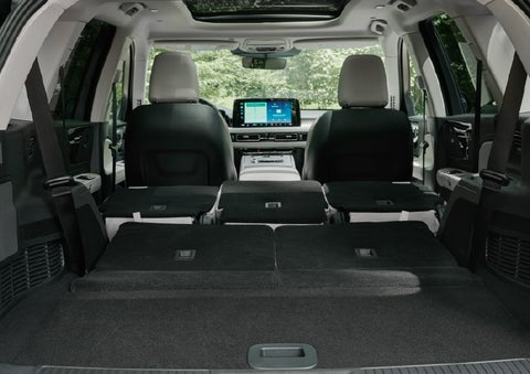 A rear to front view of the interior of a 2027 Lincoln Aviator® Black Label™ SUV shows the third and second rows folded flat | McLarty Lincoln in North Little Rock AR