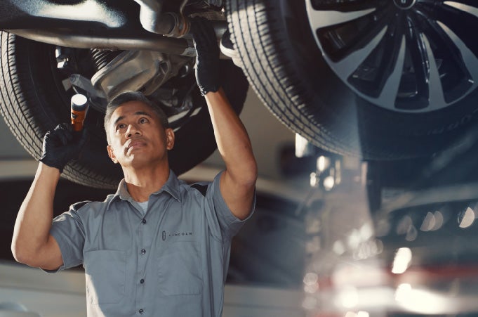 Man conducting Lincoln maintenance service